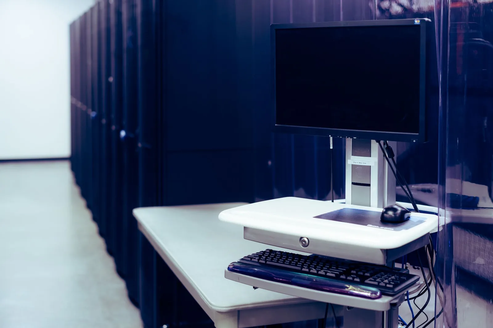 Isolated server rack in a dark data center symbolizing sandboxed Claude Code environments against agentjacking
