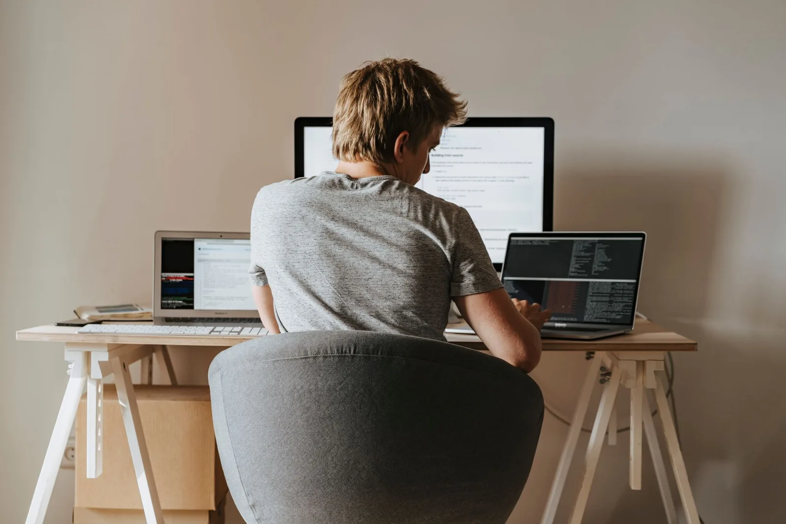 Remote developer workstation with laptop and code, illustrating AI automation work opportunities in 2026