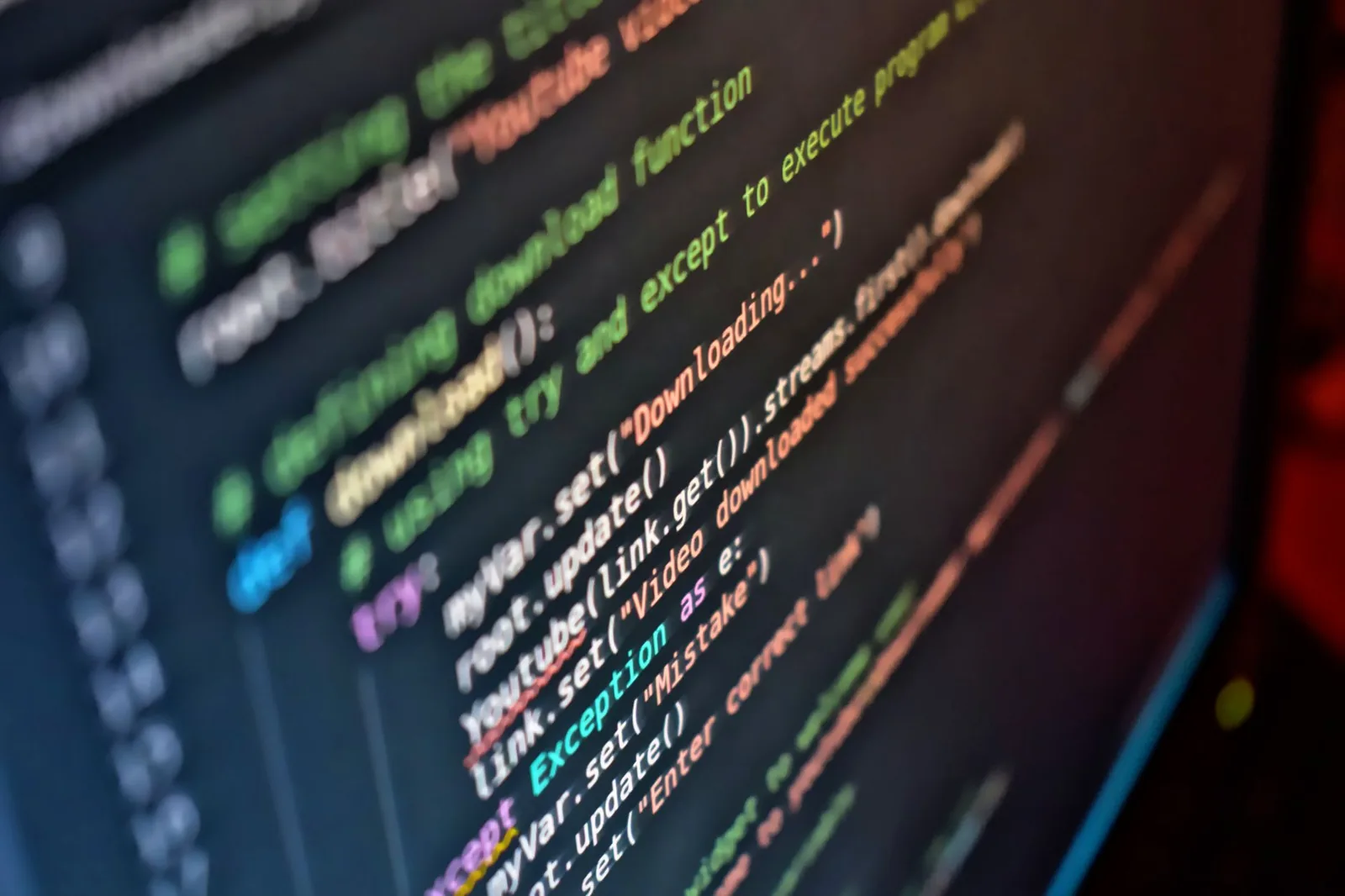 Lines of code glowing on a dark monitor, representing hands-on LangChain project building over online courses