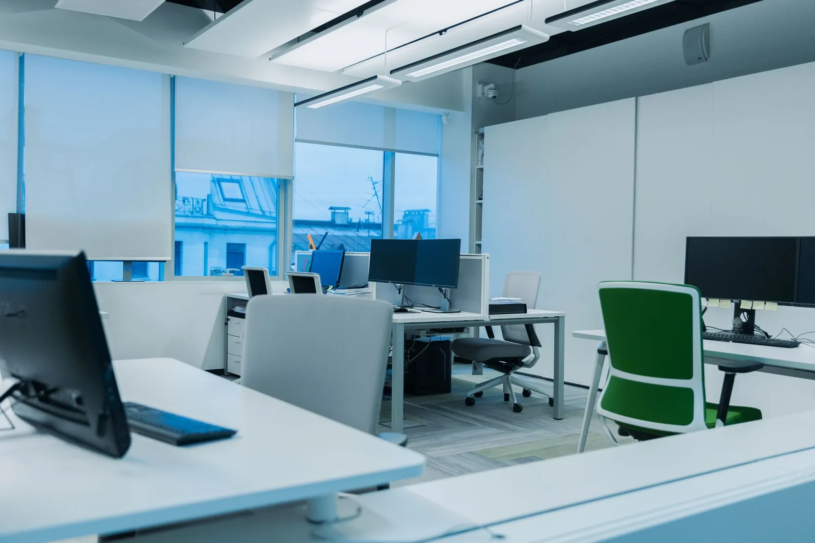 AI automation agency workspace with multiple monitors displaying analytics and workflow dashboards in 2026