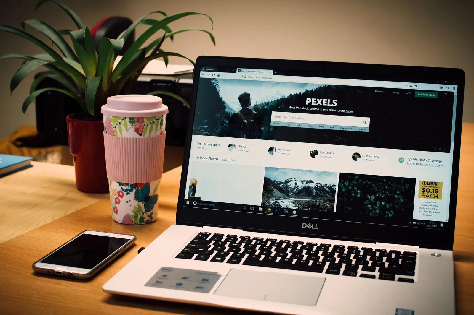 Laptop displaying website template design layout, illustrating choice between template and custom site for small business